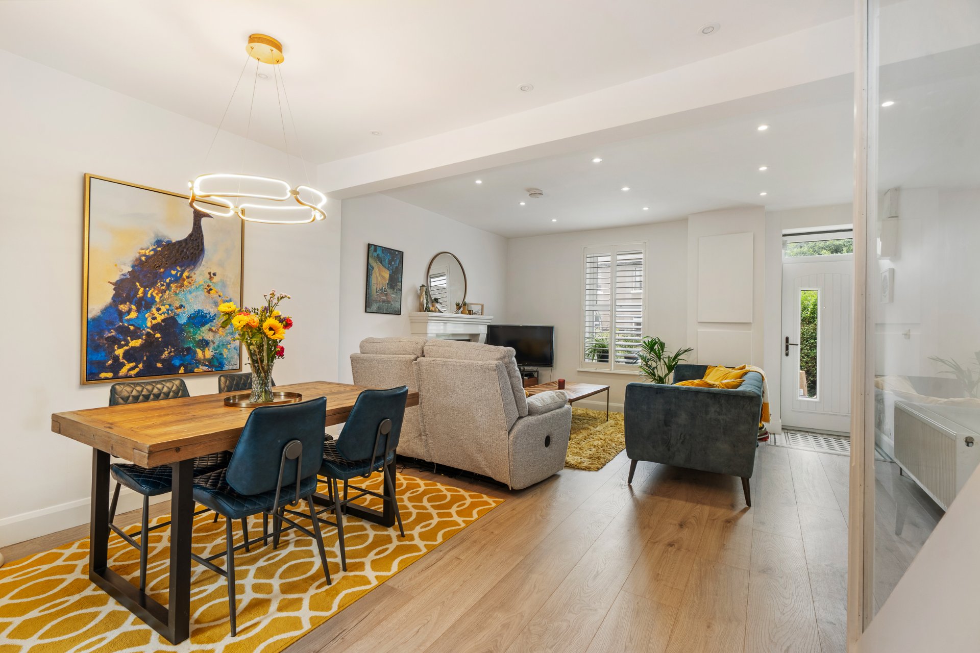 The open-plan living and dining space, looking toward the front of the house.